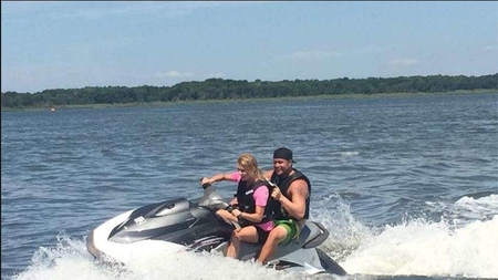 Jillian Mele in front with her possible boyfriend on a water bike